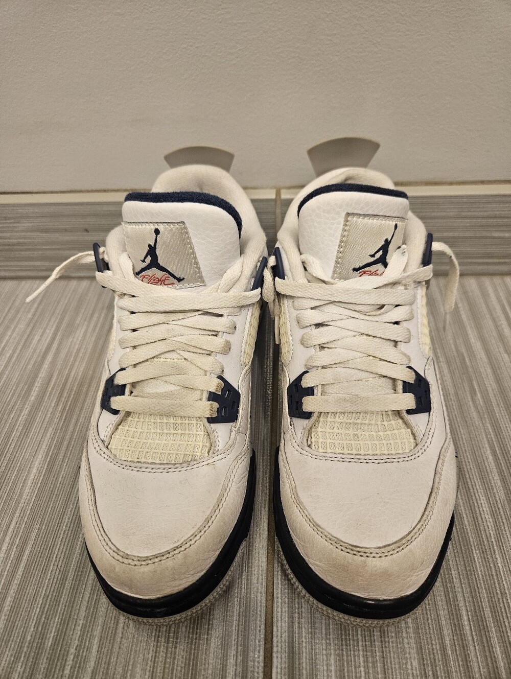 Nike Air Jordan 4 Retro "Midnight Navy" sneakers in white and navy blue leather